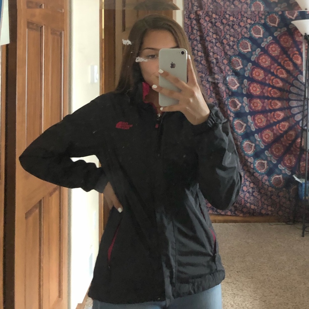 Black and pink north face lined wind breaker